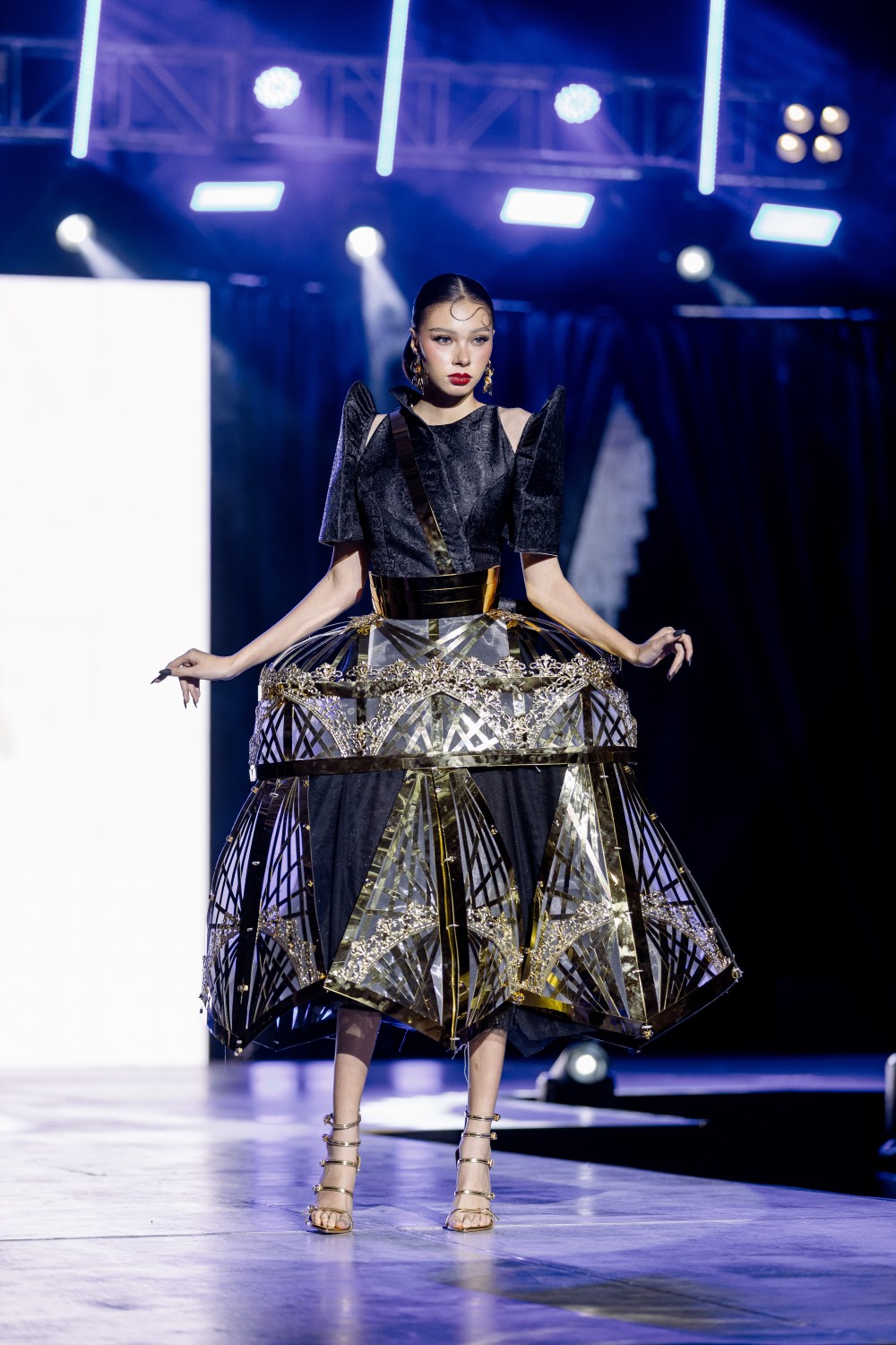 Runway terno in dark tones with butterfly sleeves and structured skirt, winner of Best Terno Award for High-Fashion at Buglasan Festival 2025