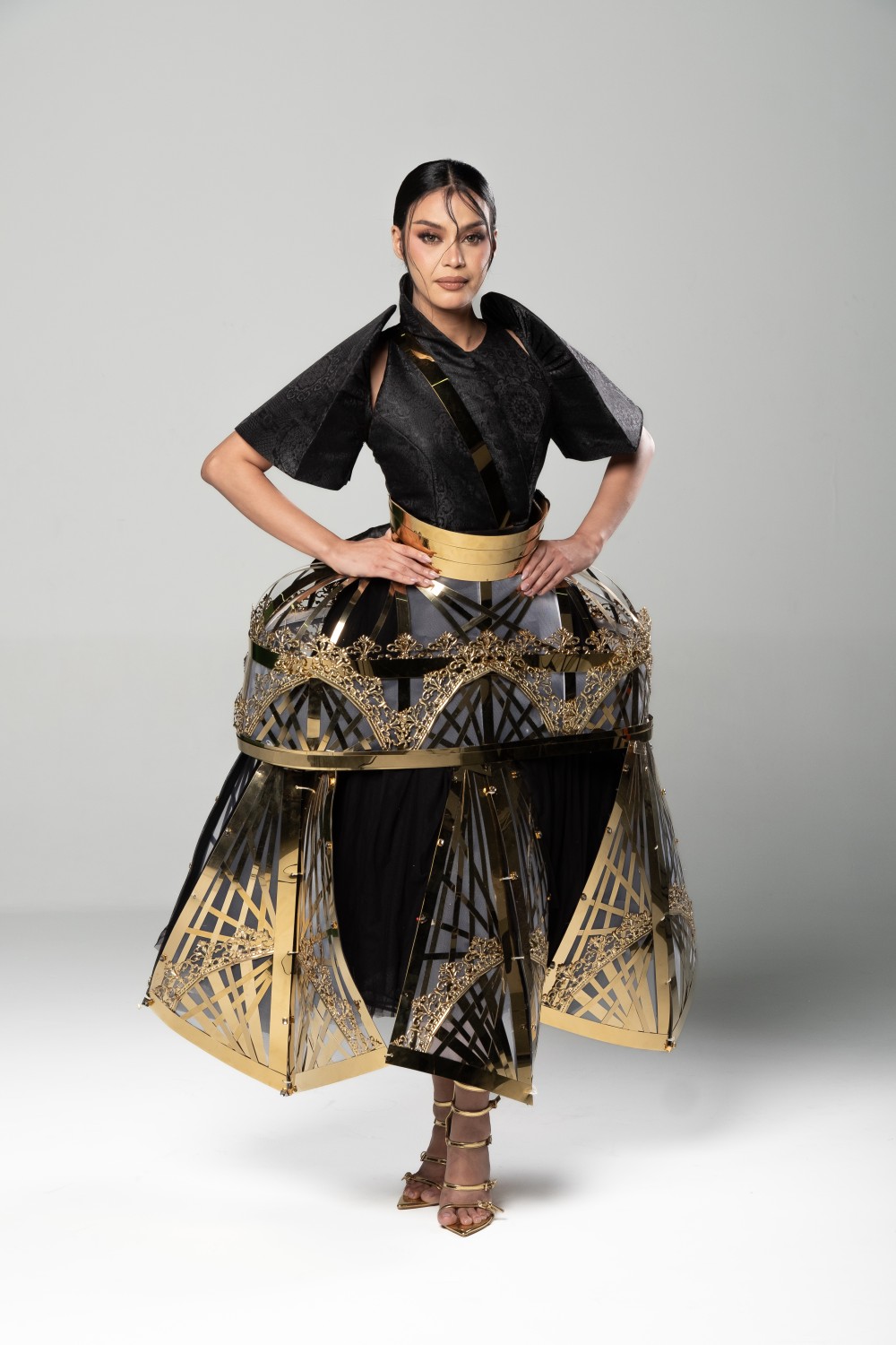 contemporary Filipiniana with circular metal cage skirt and structured black bodice