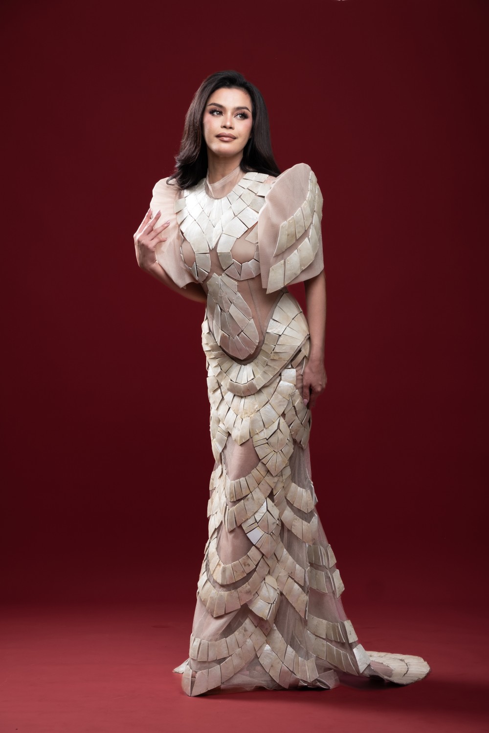 full-length modern Filipiniana dress with segmented ivory surface and fitted mermaid line