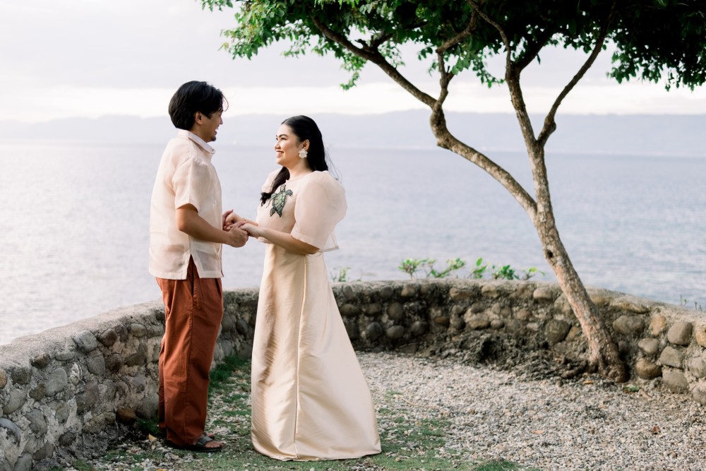 Custom Filipiniana wedding dress and modern Barong Tagalog by Josip Tumapa Design for a coastal ceremony