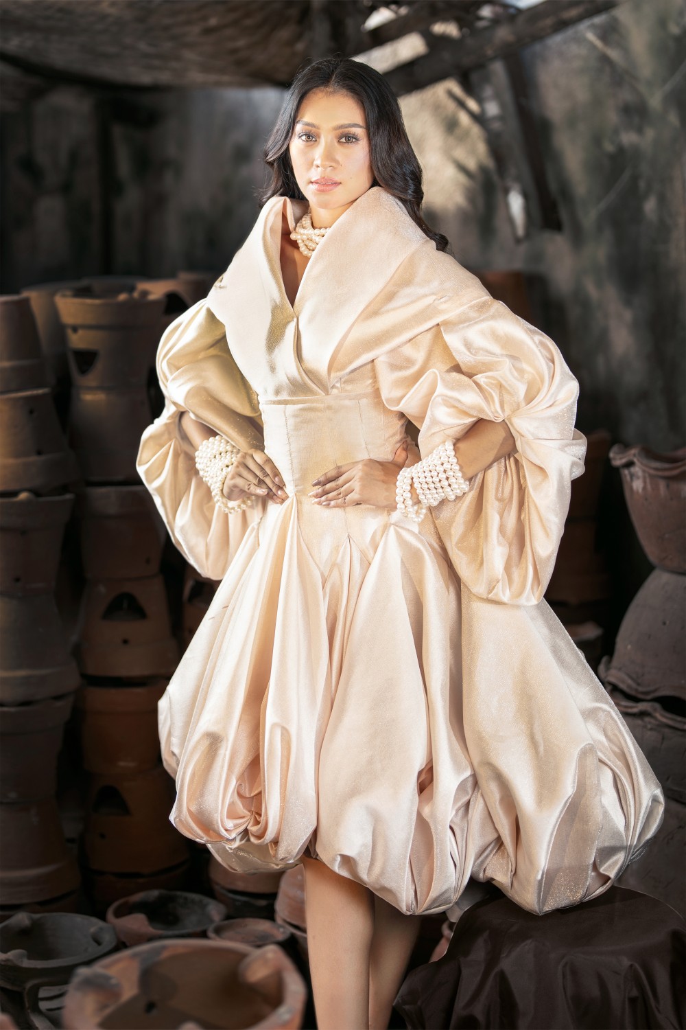 Erica Jean Cadayday in Golden Isles Pearl Filipiniana dress with voluminous sleeves, fitted waist, and pearl accessories
