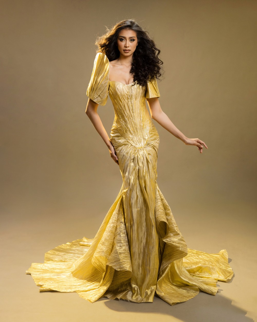 Erica Jean Cadayday in Gold Filipiniana Gown Erica Jean Cadayday, Miss Universe Philippines Camiguin participant, wearing a gold Filipiniana gown by Josip Tumapa