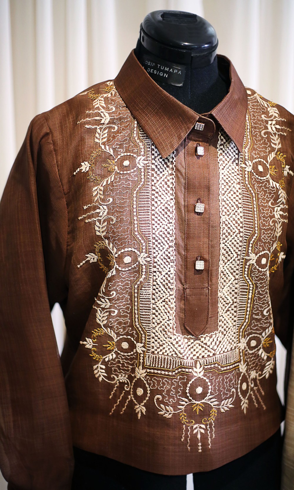 Brown pi&ntilde;a cocoon silk barong with dense hand embroidery panel and tailored wedding construction